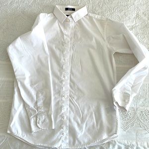 Tommy Hilfiger long sleeved boys button down shirt.
